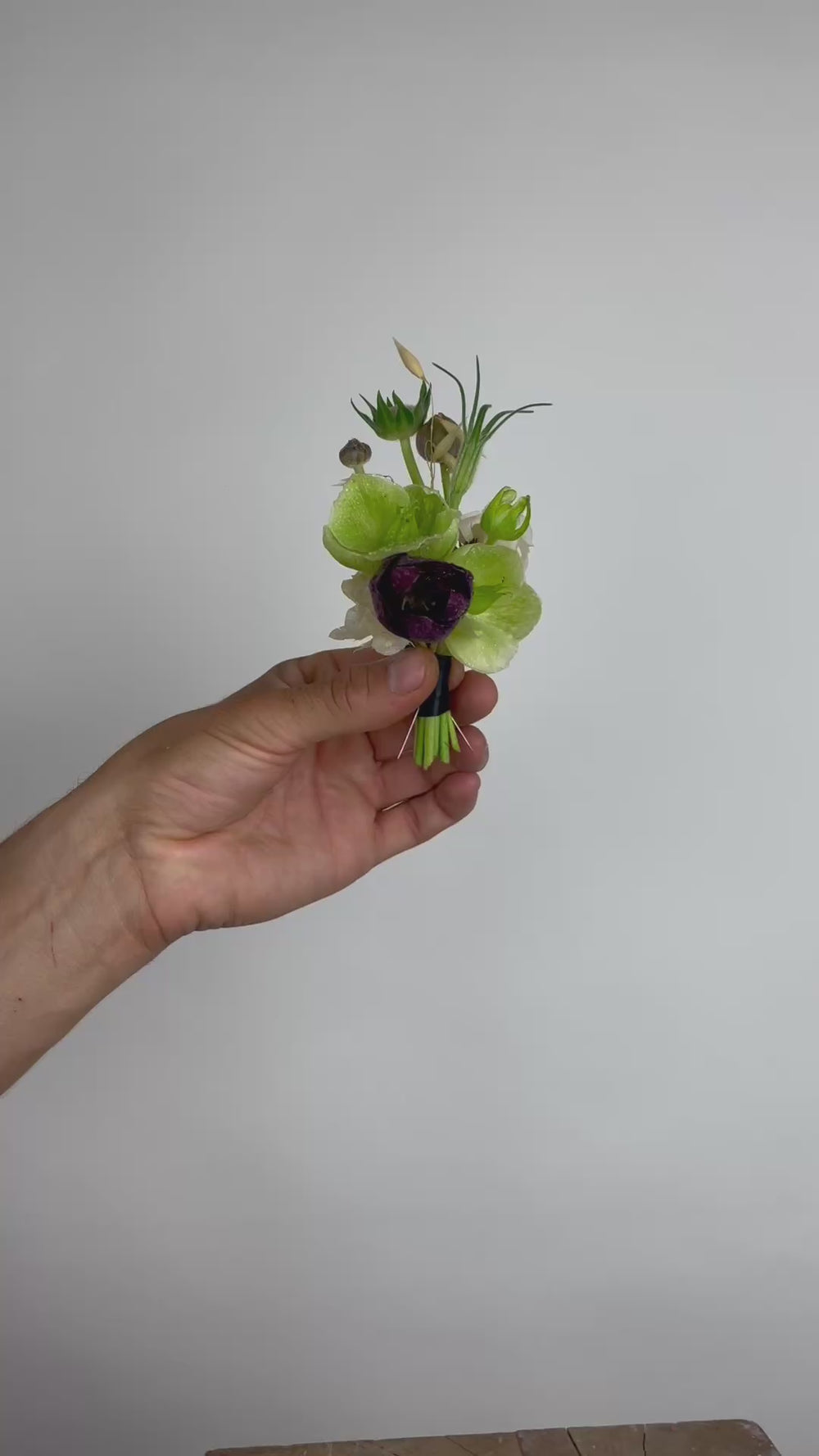 FDK Florals boutenniere complete with black ribbon and two pins.

Floral selection is dependent on seasonal stems supplied by our Hudson Valley growers and wholesale partners.